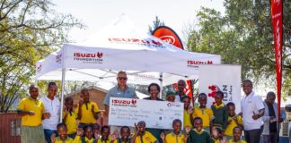 ISUZU brings water to Sebone Primary School Isuzu staff with the puils from Sebone Primary Schoo